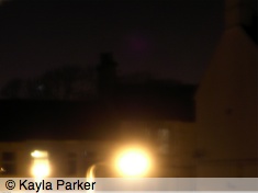 Kayla's photo of the new moon, just visible above rooftops